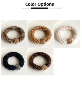 Detail of five-color thick knitted hair ties with sparkling rhinestone ball ornaments