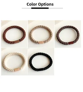 Macro detail of high-elastic braided hair ties in various neutral coffee shades