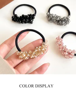 Detail display of crystal bead hair ties in black, grey, champagne, and pink colors
