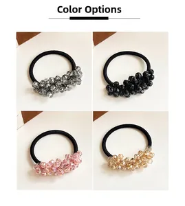 Detail view of high-elastic crystal bead hair ties in grey, black, pink, and gold colors