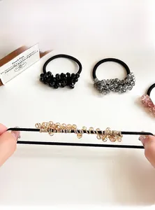 Detail showing high-elasticity hair ties with multi-color faceted crystal beads