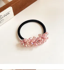 Detail of pink crystal-like faceted beads on a durable black elastic hair scrunchie
