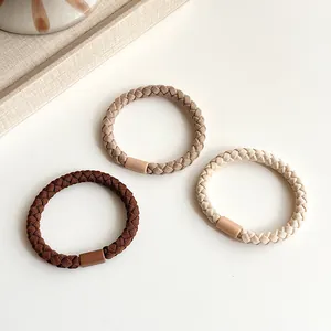 Three earth-toned high elasticity braided hair ties in brown, khaki, and cream colors