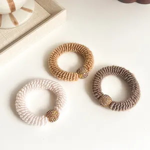 Three-piece set of thick knitted hair ties with sparkling rhinestone gold beads