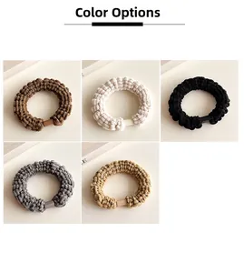 Detail of thick elastic velvet hair ties with knitted texture and resin buckles in 5 colors