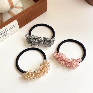 Three-piece set of elegant crystal beaded hair ties in grey, pink, and champagne colors