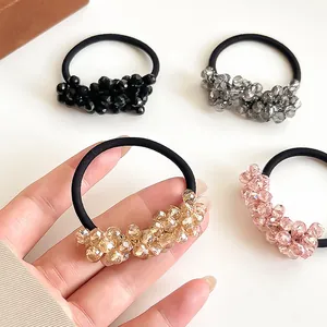 Elegant crystal beaded hair ties in black grey gold and pink for high ponytail