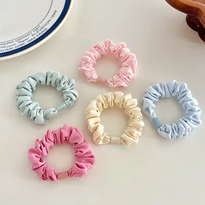 Five-piece set of macaron-colored pleated hair scrunchies in pastel fabric tones