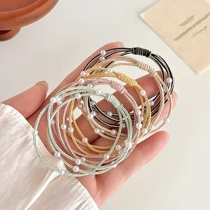 Meerkleurige elastische haarelastiekjes met parels en gouden draad voor paardenstaarten