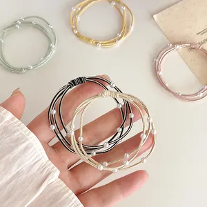 Elastische haarelastiekjes met witte parels in diverse pastelkleuren en hoge rek