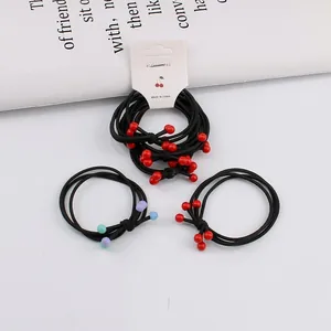 Set of 4 minimalist elastic hair ties with colorful beads on white display card