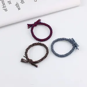 Three-piece set of braided twist hair ties with bows in burgundy, brown and blue colors
