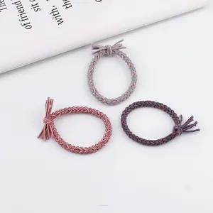 Three-piece set of woven elastic hair ties with fringe knots in purple and pink tones