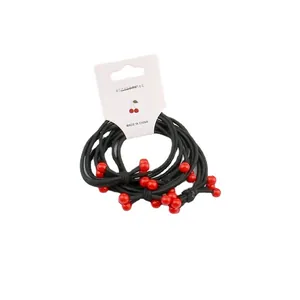 Set of four black elastic hair ties with red cherry beads on white display card
