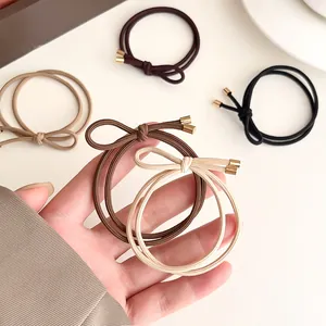 Elastic bow hair tie set in coffee tones with elegant gold metal tips for women