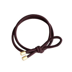 Elastic bow hair tie in coffee brown with dual cords and golden metal fasteners