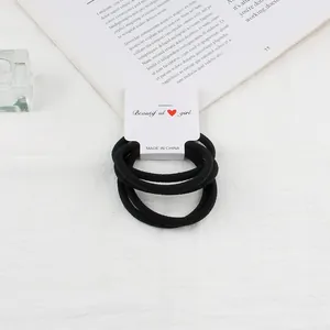 Pack of black high-elastic hair ties set on white aesthetic lifestyle background