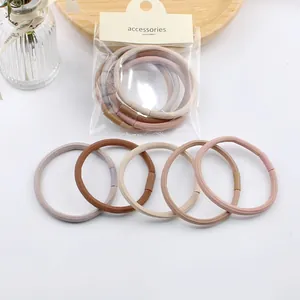 Detailed set of 5 elastic hair ties in Morandi colors with ribbed texture and packaging