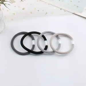 Set of 4 high-elastic braided hair ties in neutral tones with pearlescent oval beads