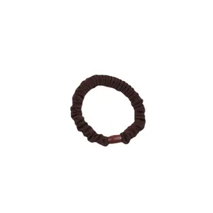 Elastic dark brown pleated scrunchie with a glossy decorative oval bead for daily hair styling