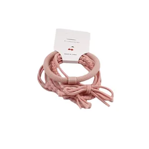Set di 6 elastici per capelli rosa con fascia a coste e fiocchi su cartoncino