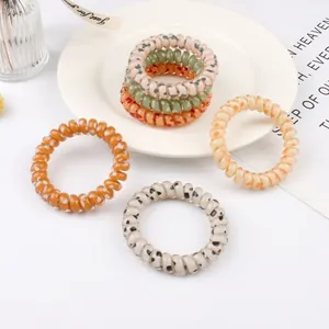 Set of polka dot spiral hair ties and heart pattern telephone wire bands for women