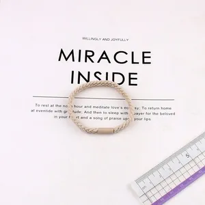 Elastic beige braided hair tie with durable thick design and high stretch for ponytails