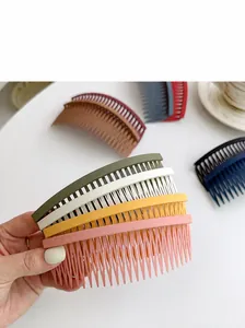 Close-up of matte resin hair side combs in various colors with a sleek non-slip design