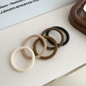 Vier große Spiral-Haargummis in Milchkaffee-Erdtönen für Pferdeschwänze