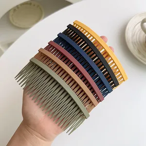 Set of 7 colorful matte hair side combs for styling and securing bangs in a soft white setting