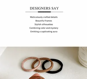Detail of high-elasticity ribbed hair ties in coffee, lotus pink, and black colors