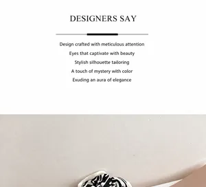 Detailed close-up showing the soft pleated texture of black and white zebra print scrunchie