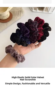 Close-up of high-elastic velvet scrunchies in assorted dark colors on a cozy background
