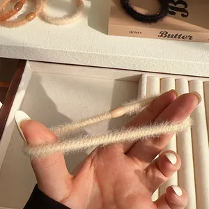 Plush cream scrunchie for women with high elasticity and faux mink fur texture
