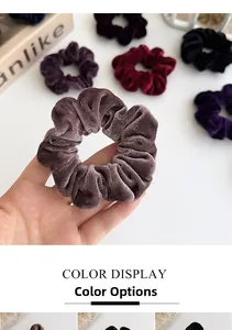 Detailed macro view of large velvet scrunchies showing soft texture and high elasticity
