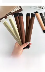 Detail showing various colors of synthetic hair bun maker tools with flexible structure