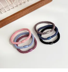 Close-up of high-elastic braided hair ties in six Morandi colors with glossy buckles