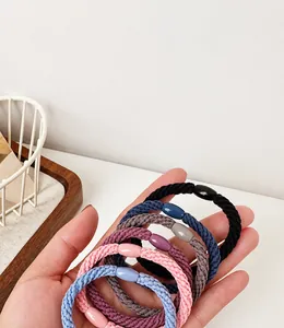 Close-up of durable elastic hair ties in Morandi colors with smooth oval bead accents