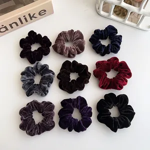 9-piece set of large velvet hair scrunchies in various rich autumn colors for women