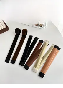 Nine diverse hair bun makers in multiple shades displayed on a clean white surface