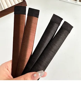 Close-up of black and brown synthetic hair bun makers for elegant hairstyles