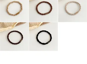Detailed weave of durable high-elastic coffee-toned hair ties in earthy neutral shades