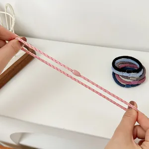Elastic braided hair ties in multiple colors shown with high stretch durability test