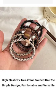 Close-up of elastic two-tone woven hair ties in neutral earth tones held in hand