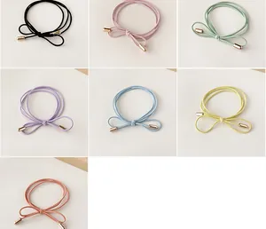 Detail of high-elasticity bow hair ties in seven macaron colors with rose gold metal buckles