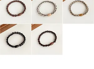 Detailed view of elastic woven hair ties in five colors with smooth resin buckles