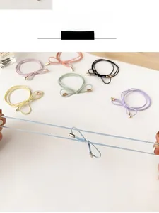Detail display of high elastic bow hair ties in various pastel candy colors