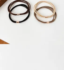 Detail of four-in-one high elasticity hair ties with elegant gold metal buckles