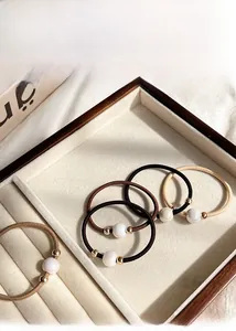 Elastic hair ties set with faux pearls and gold beads in coffee and neutral tones