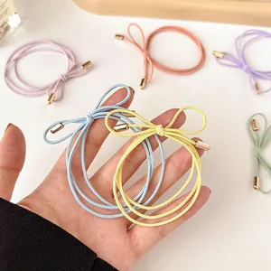 Colorful high-elastic bow hair ties with gold metal accents in macaron pastel shades